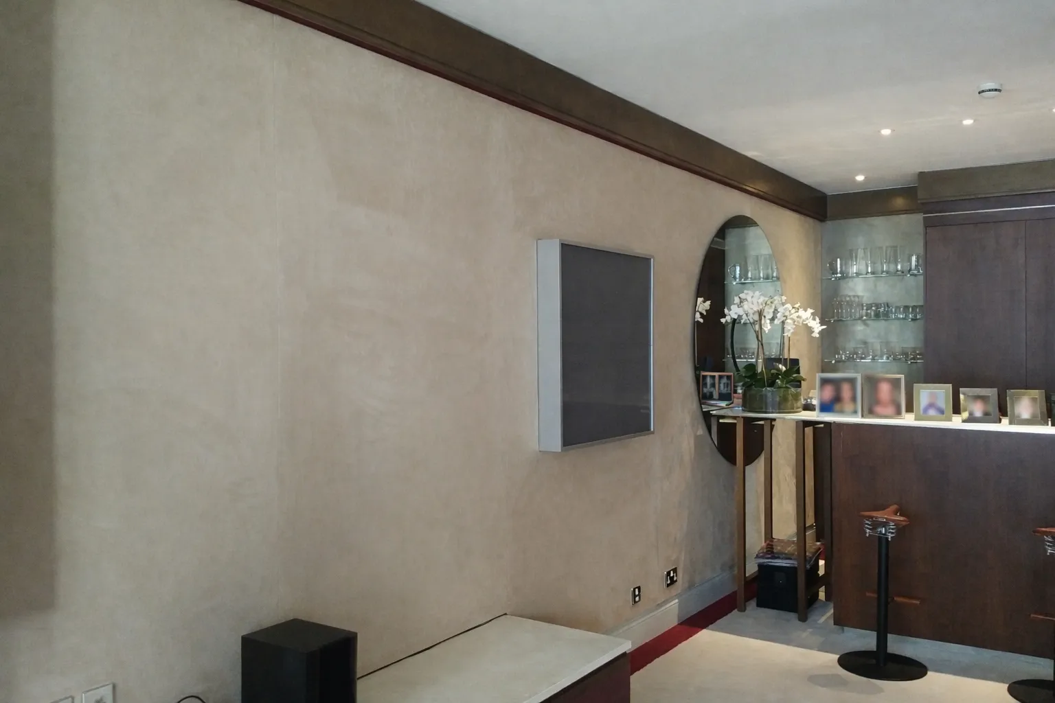 Modern residential living room featuring a bespoke stretch-fabric textured wall finish
